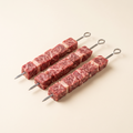 Raw beef brochette skewers