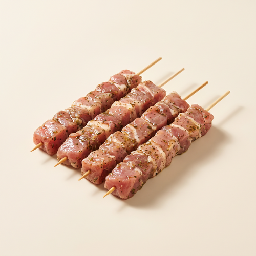 Raw marinated souvlaki skewers
