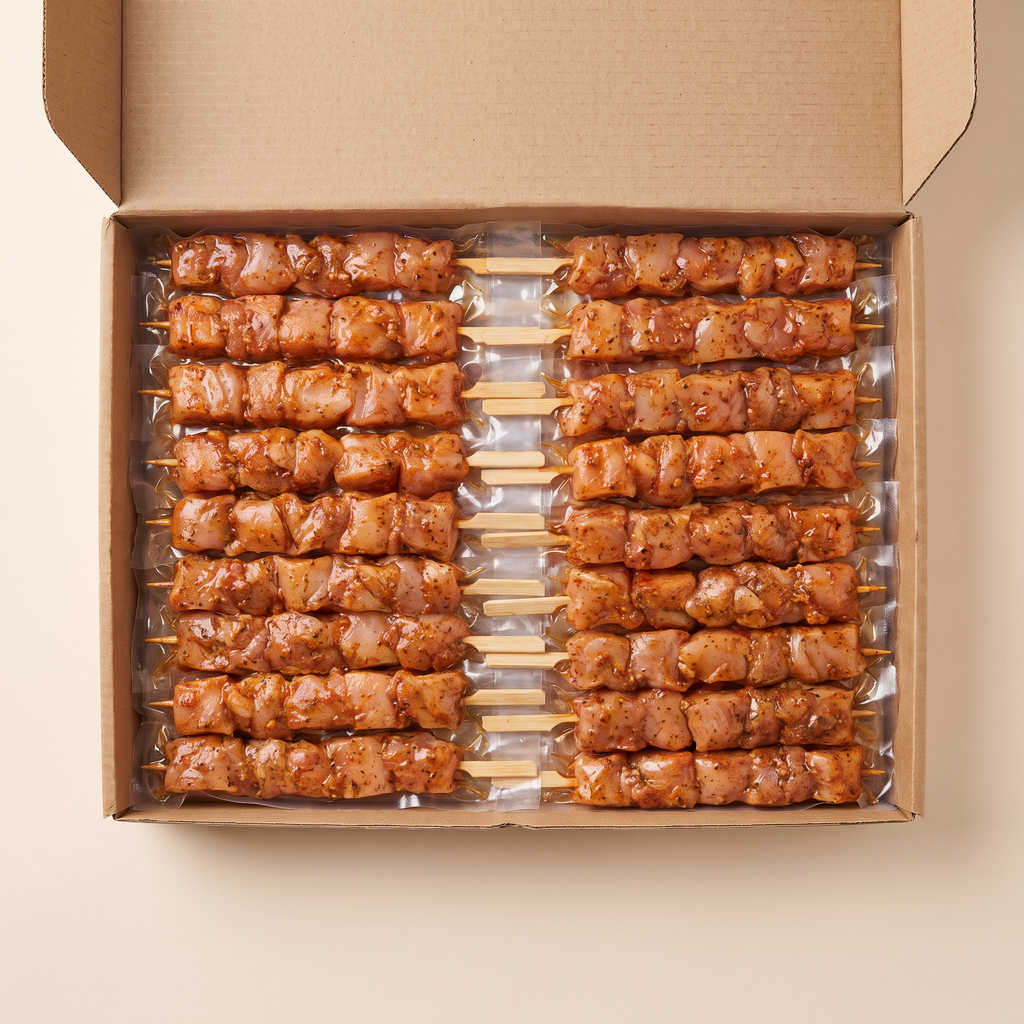 Full box — vacuum-sealed portions of chicken souvlaki