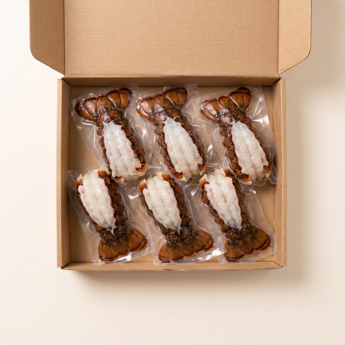 Full box — vacuum-sealed portions of lobster tails xl