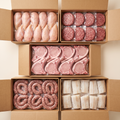 The Family Stock-Up bundle — five full boxes: chicken, ground beef, pork chops, Italian sausages, cod